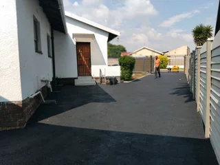 Brick paving and tar surfacing