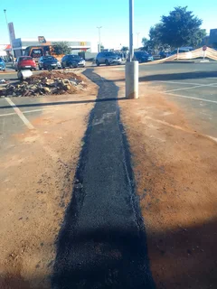 Brick paving and tar surfacing
