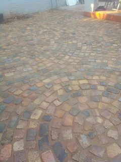 Cobble half brick paving and tar surfacing