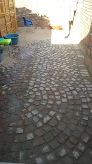 Cobble half brick paving and tar surfacing