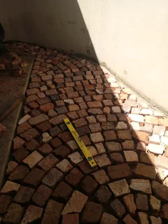 Cobble half brick paving and tar surfacing
