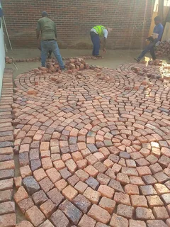Cobble half brick paving and tar surfacing
