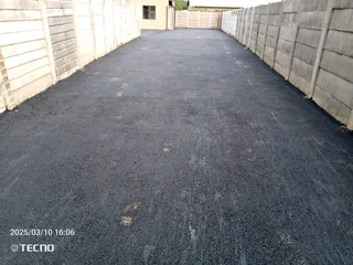 Tar surfacing and brick paving