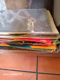 Lps stack of different artist all in its own c9vers