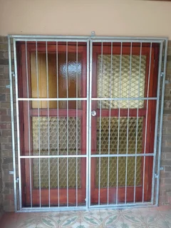 Aluminium trellis and steel burglars, gates