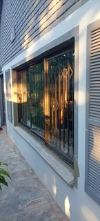 Aluminum doors, sliding windows, trelli burglars, stacker doors