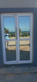 Aluminum doors, sliding windows, trelli burglars, stacker doors