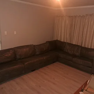 Grey custom made genuine leather L shape lounge suite.