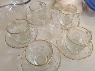 Glass tea cup with saucer