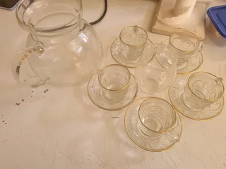 Glass tea cup with saucer