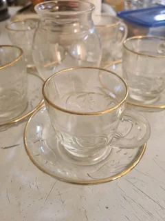 Glass tea cup with saucer