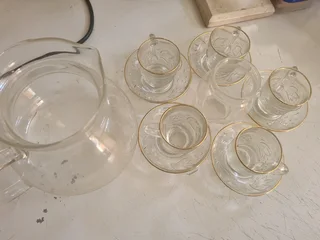 Glass tea cup with saucer