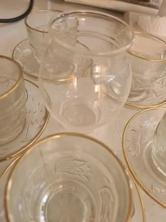 Glass tea cup with saucer