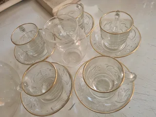 Glass tea cup with saucer