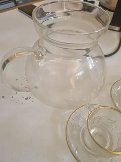 Glass tea cup with saucer