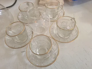 Glass tea cup with saucer