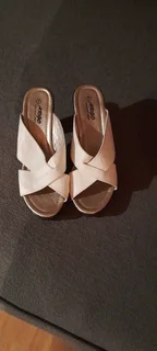 Ladies White Sandals with light - weight black sole and heel. Good as new.