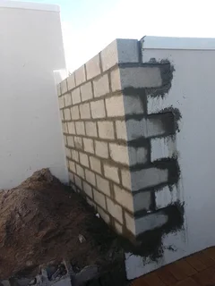 Bricklaying, plastering and skimming