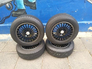 A set of 14inches universal PCD 4x100 4x108 PCD rims with tyres for toyota runx/Etios/Datsun Go