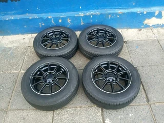 A set of 14inches universal PCD 4x100 /4x108 PCD mags with tyres for Toyota runx/ etios /Datsun Go