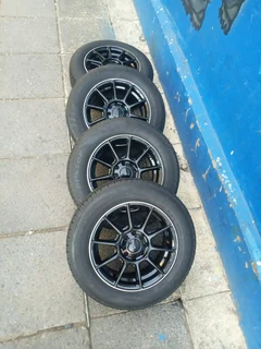 A set of 14inches universal PCD 4x100 /4x108 PCD mags with tyres for Toyota runx/ etios /Datsun Go