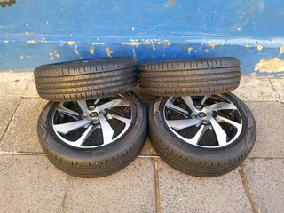 A set of 16inches original Toyota starlet mags 4x100 PCD with 90% thread tyres also fit toyota yaris