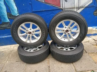 A set of 17inches original isuzu Dmax bakkie or isuzu suv mags rim 6x139.7 pcd with 265/65R17 Dunlop