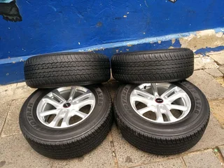 A set of 17inches original isuzu Dmax bakkie or isuzu suv mags rim 6x139.7 pcd with 265/65R17 Dunlop