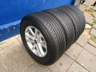 A set of 17inches original isuzu Dmax bakkie or isuzu suv mags rim 6x139.7 pcd with 265/65R17 Dunlop