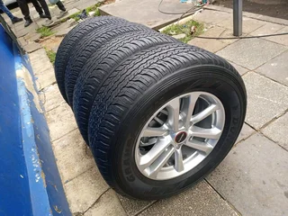 A set of 17inches original isuzu Dmax bakkie or isuzu suv mags rim 6x139.7 pcd with 265/65R17 Dunlop