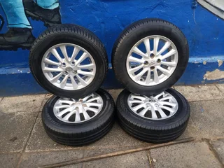 set of 15inches original Toyota etios mags 4x100 PCD with tyres also fit toyota corolla/ Toyota Runx