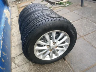 set of 15inches original Toyota etios mags 4x100 PCD with tyres also fit toyota corolla/ Toyota Runx