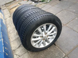 set of 15inches original Toyota etios mags 4x100 PCD with tyres also fit toyota corolla/ Toyota Runx