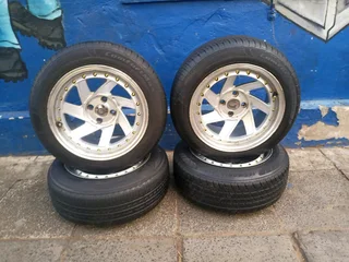 A set of 15inches deep dich mags 4x100 PCD with tyres for Toyota Runx /Etios /Datsun Go /Hyundai i20