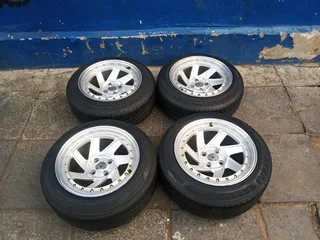 A set of 15inches deep dich mags 4x100 PCD with tyres for Toyota Runx /Etios /Datsun Go /Hyundai i20