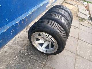 A set of 15inches deep dich mags 4x100 PCD with tyres for Toyota Runx /Etios /Datsun Go /Hyundai i20