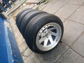 A set of 15inches deep dich mags 4x100 PCD with tyres for Toyota Runx /Etios /Datsun Go /Hyundai i20