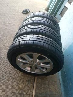 A set of 14inches original hyundai i10 mags rim 4x100 PCD with 95%thread tyres also fit hyundai acce