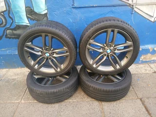 A set of 18inches original BMW 1 and 2 series mags 5x120 PCD Narrow and wide with Runflat tyres