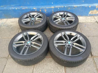 A set of 18inches original BMW 1 and 2 series mags 5x120 PCD Narrow and wide with Runflat tyres