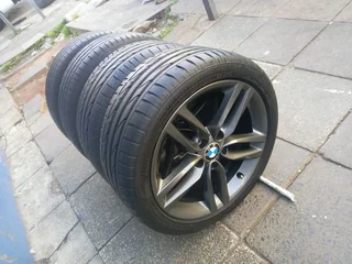 A set of 18inches original BMW 1 and 2 series mags 5x120 PCD Narrow and wide with Runflat tyres