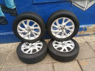 A set of 16inches original Toyota corolla prestige mags 5x114.3 PCD with tyres.Also fit Toyota corol