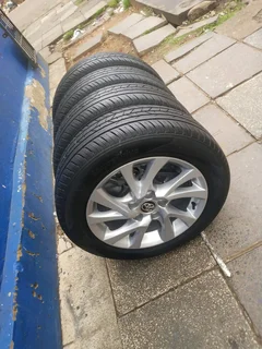 A set of 16inches original Toyota corolla prestige mags 5x114.3 PCD with tyres.Also fit Toyota corol