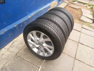 A set of 16inches original Toyota corolla prestige mags 5x114.3 PCD with tyres.Also fit Toyota corol