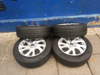 A set of 16inches original Toyota corolla prestige mags 5x114.3 PCD with tyres.Also fit Toyota corol