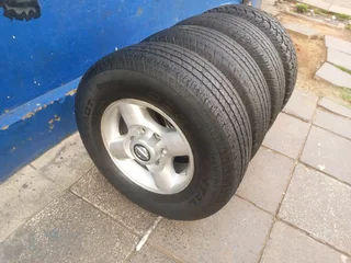 A set of 16inches original Nissan hardbody NP300 mags 6x139.7 PCD with tyres. Also fit Isuzu bakkie