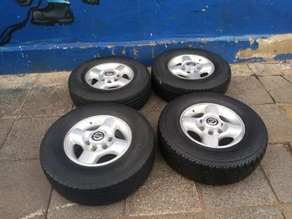 A set of 16inches original Nissan hardbody NP300 mags 6x139.7 PCD with tyres. Also fit Isuzu bakkie