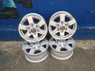 A clean set of 16inches original Nissan hardbody NP300 mags 6x139.7 PCD. Also fit Isuzu bakkie /ford