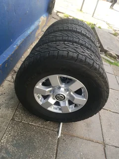 A clean set of 16inches original Nissan hardbody NP300 mags 6x139.7 PCD with Bridgestone tyres