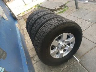 A clean set of 16inches original Nissan hardbody NP300 mags 6x139.7 PCD with Bridgestone tyres